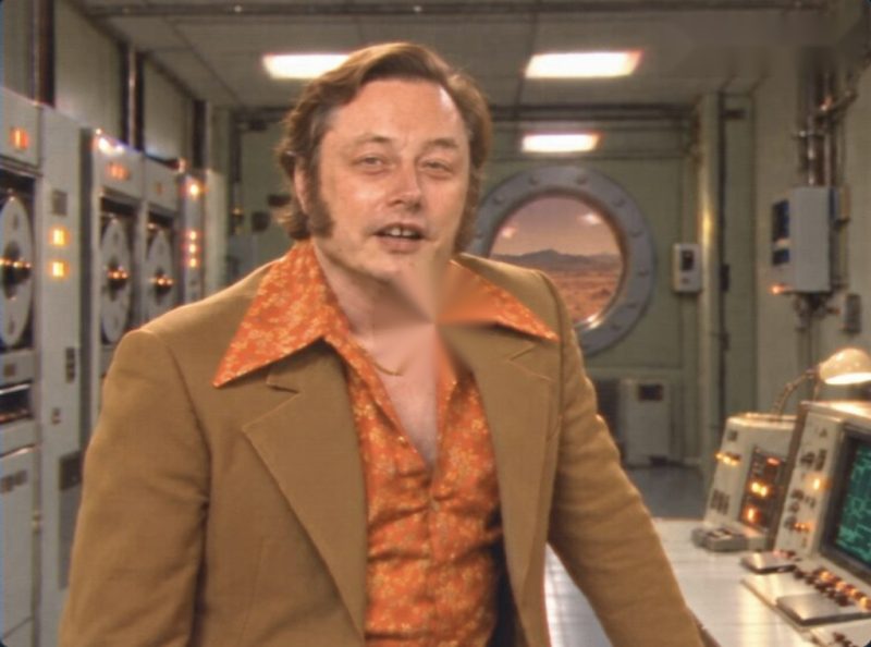 MARSx video: a man in a 1970s suit in a retro Mars control room